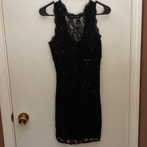 Little black dress. Size medium. Zipper closure and button at neckline in back.